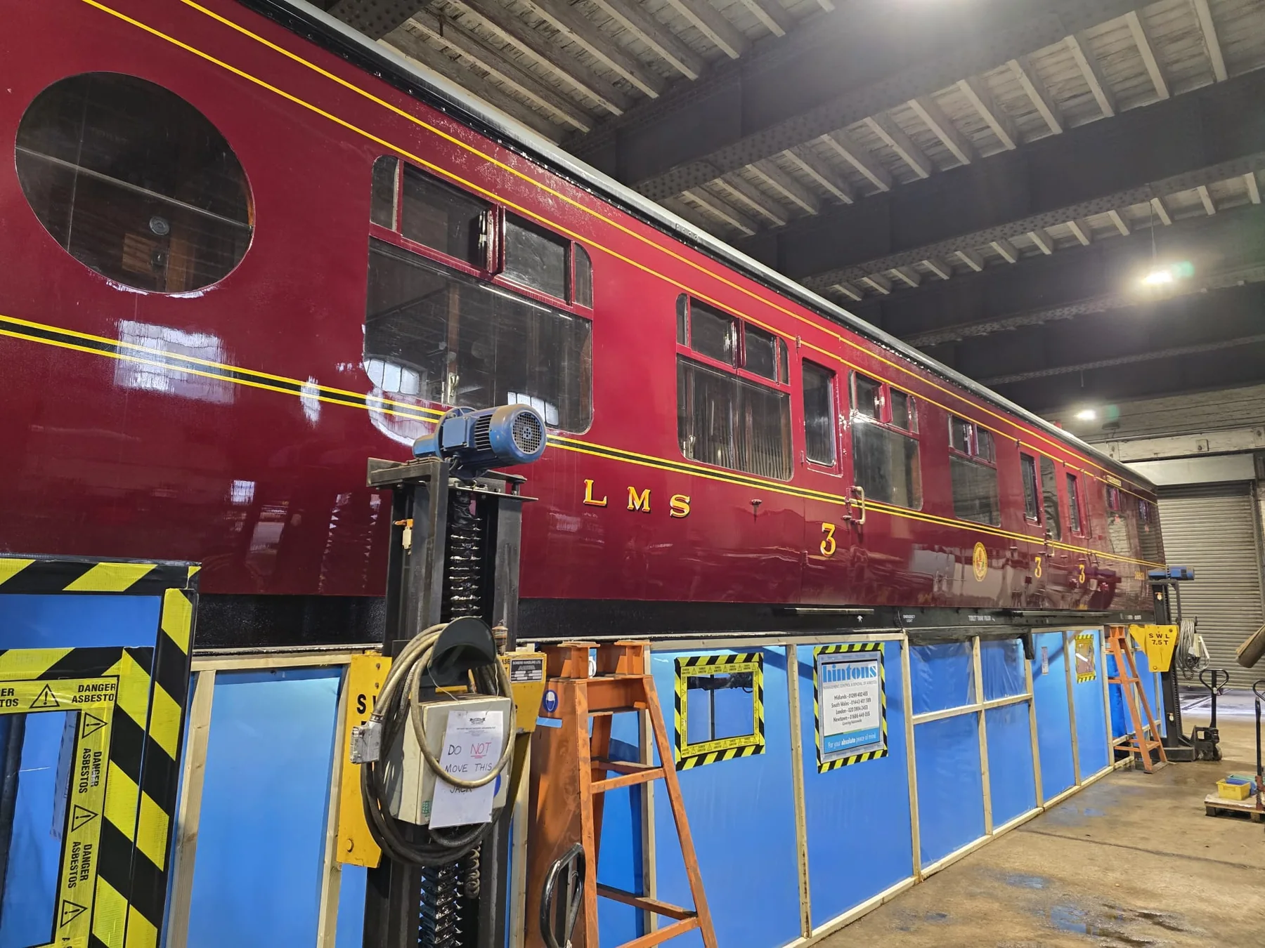 Hintons enclosure beneath a rail carriage for licensed thermal insulated pipework removal in Kidderminster