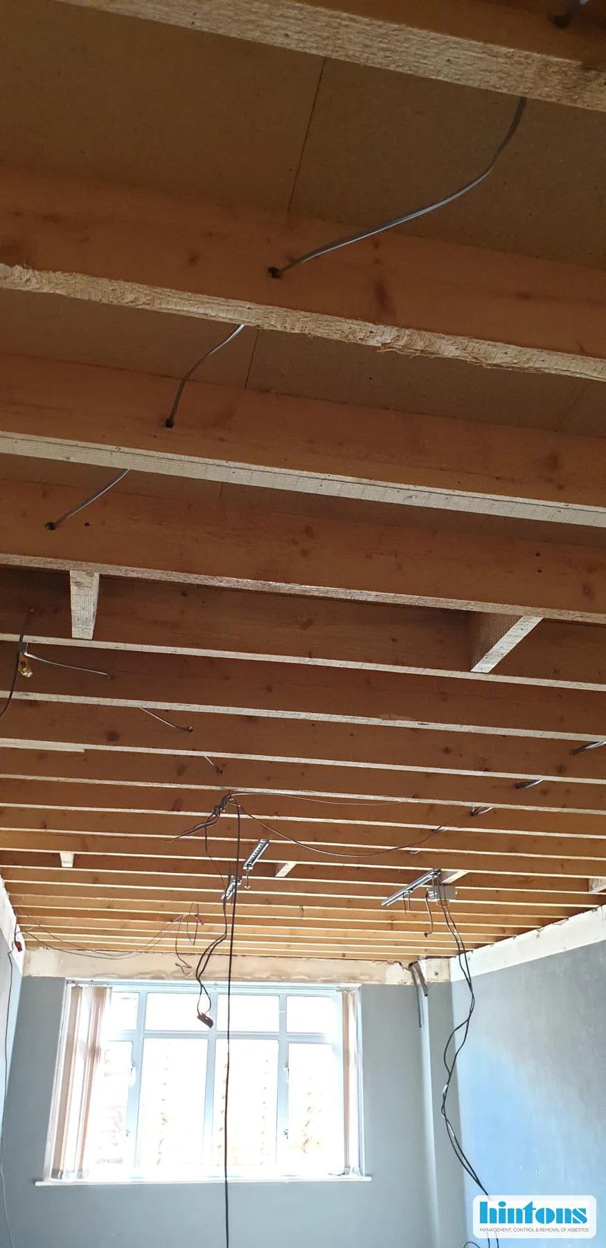 Lounge following removal of an asbestos textured coating ceiling in Newport