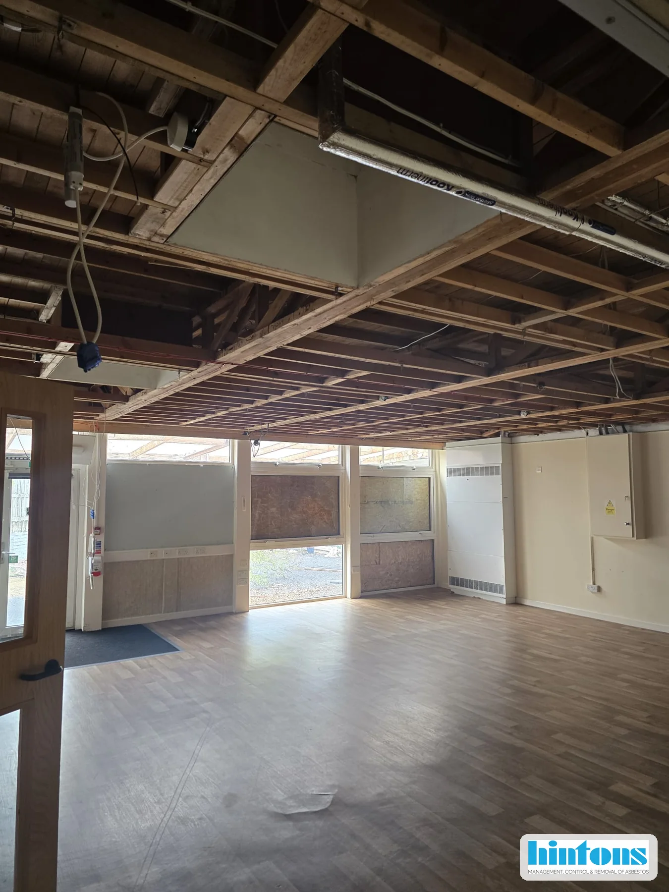 School classroom ceiling void following licensed thermal insulation debris removal in Gloucester