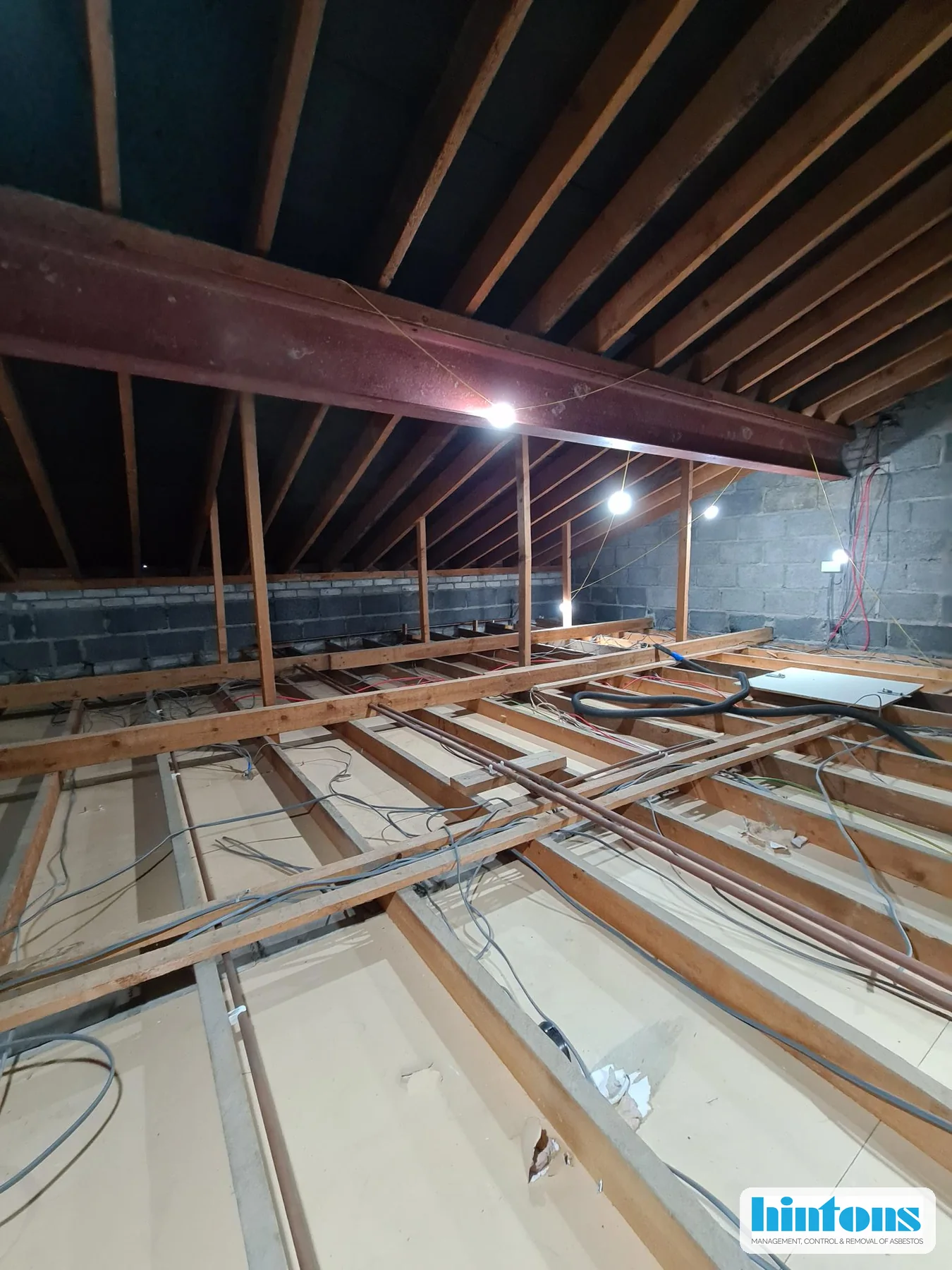 North Wales community hall loft during licensed AIB debris removal